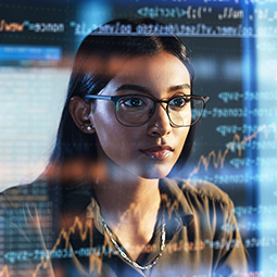 Researcher examines screen of data