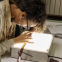 student looking at film on lightbox