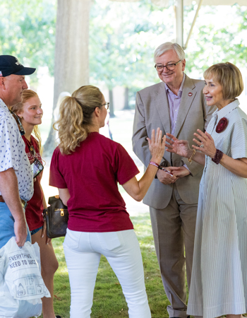 President Michael Amiridis and his wife, Ero Aggelopoulou-Amiridis, greet families.