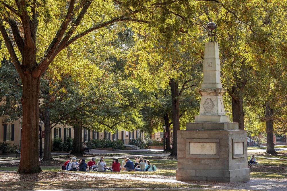 Students sit on USC’s Horseshoe